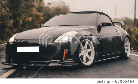 Black luxury sport coupe, vintage photoshooting Black luxury sport coupe, vintage photoshooting 65065464