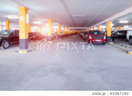 Parking for cars on a background of sunny sunset, background. Copy space, defocused Parking for cars on a background of sunny sunset, background. Copy space, defocused 65067260