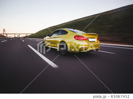 Green business class car speed motion in the highlands 65067452