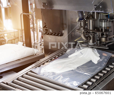 Production and manufacture of milk cream from cow's milk. Automatic, high fat automatic cream filling process, industry, milk product Production and manufacture of milk cream from cow's milk. Automatic, high fat automatic cream filling process, industry, milk product 65067601