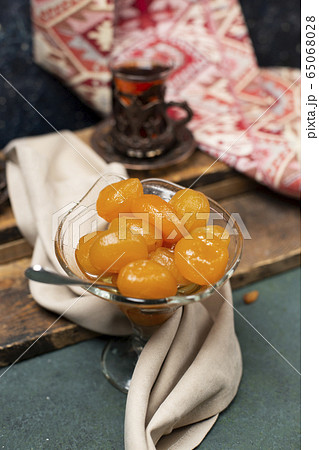 tea and fig jam on dark background tea and fig jam on dark background 65068028