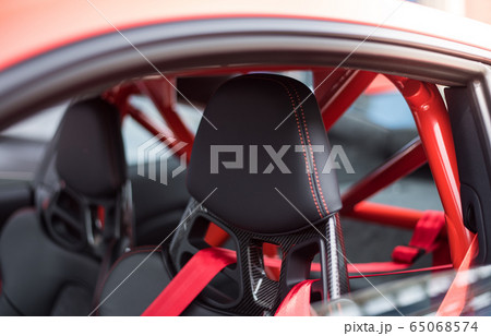 Black seats and red security belts of a car 65068574