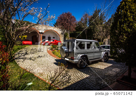 Silver sport truck parked in a farmhouse yard Silver sport truck parked in a farmhouse yard 65071142
