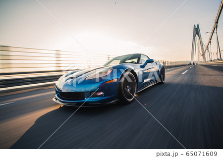Blue luxury sport car on the bridge 65071609