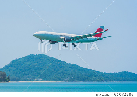 Coronavirus is over. Quarantine weakened. Take off the mask. Now you can travel. Modern airplane in 65072286