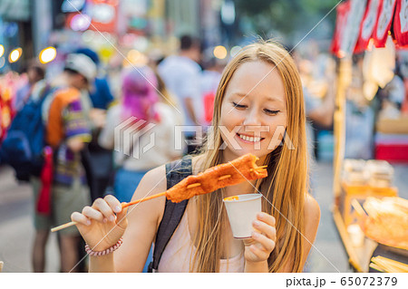Coronavirus is over. Quarantine weakened. Take off the mask. Now you can travel. Young woman tourist 65072379