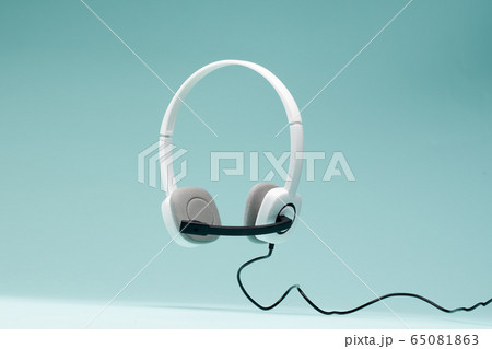 Headphones isolated on empty blue background. 65081863