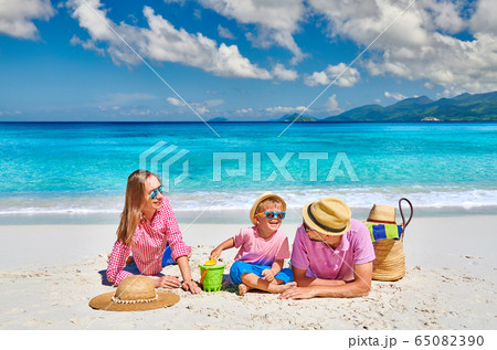 Family with three year old boy on beach. Family with three year old boy on beach. 65082390