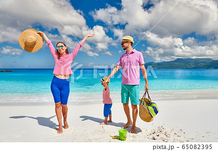 Family with three year old boy on beach. Family with three year old boy on beach. 65082395
