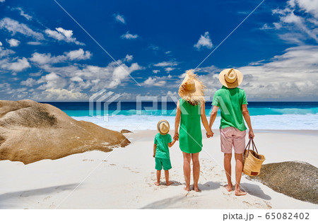 Family with three year old boy on beach. Family with three year old boy on beach. 65082402