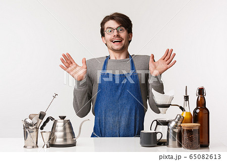Barista, cafe worker and bartender concept. Surprised happy young man in apron, gasping amused and smiling cheerful camera clasp hands excited, standing over coffee counter, white background Barista, cafe worker and bartender concept. Surprised happy young man in apron, gasping amused and smiling cheerful camera clasp hands excited, standing over coffee counter, white background 65082613
