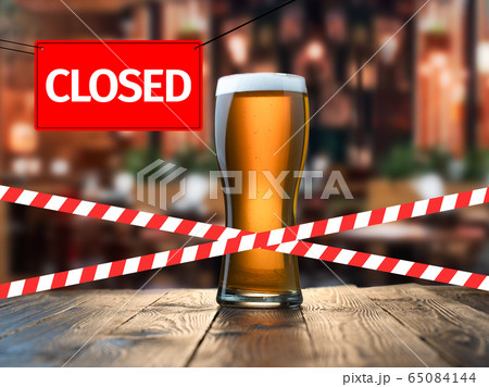 Closed due to a pandemic. Premises of pub are covered with red and white ribbon. 65084144