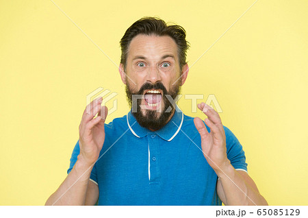 Overwhelmed with emotions. Handsome shouting 65085129