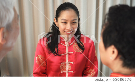 Chinese family happy together in Chinese New Year gathering 65086576