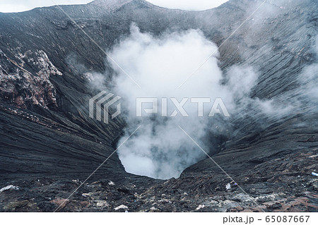 Photo of smoke volcano crater on Java island Photo of smoke volcano crater on Java island 65087667