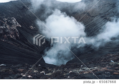 Photo of smoke volcano crater on Java island 65087668