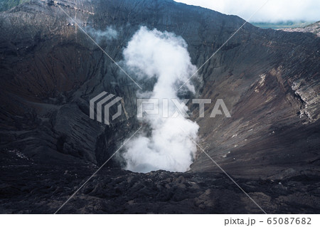 Photo of smoke volcano crater on Java island 65087682
