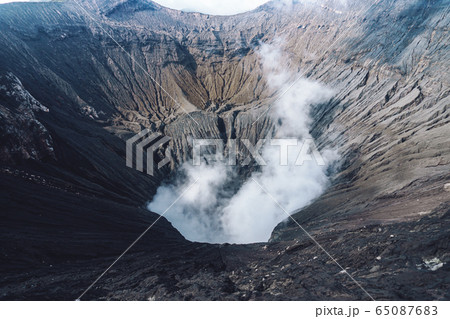 Photo of smoke volcano crater on Java island 65087683