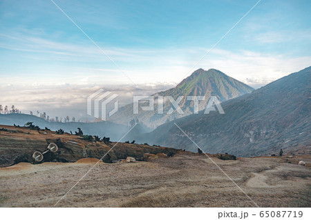 Photograph of high volcano with clouds on Java 65087719