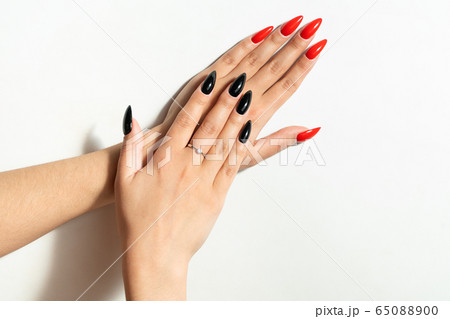 Beautiful female hands. With an unusual manicure. Separate on a white background. Nail salon. 65088900