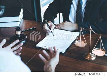 Male lawyer discussing negotiation legal case with Male lawyer discussing negotiation legal case with 65091198