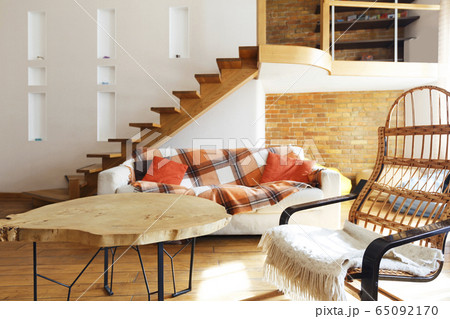 Modern cozy loft. Chair, table and sofa Modern cozy loft. Chair, table and sofa 65092170