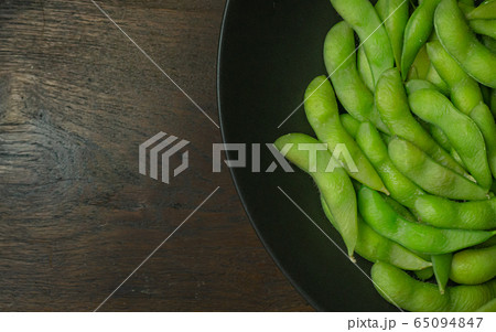 The Edamame in black plate top view image for food content. The Edamame in black plate top view image for food content. 65094847
