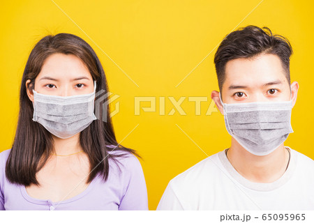 woman and handsome man wearing protection face 65095965