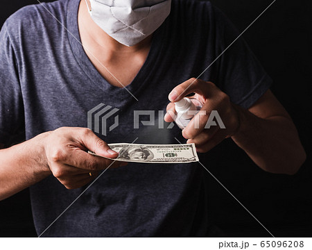 man wearing protective face mask applying man wearing protective face mask applying 65096208
