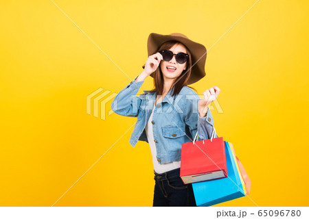 woman teen smiling standing with sunglasses woman teen smiling standing with sunglasses 65096780