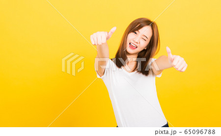 woman teen standing wear t-shirt showing gesturing woman teen standing wear t-shirt showing gesturing 65096788