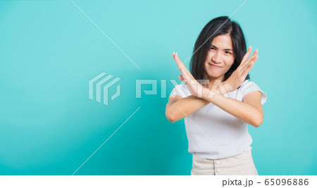 woman unhappy or confident standing, She holding woman unhappy or confident standing, She holding 65096886