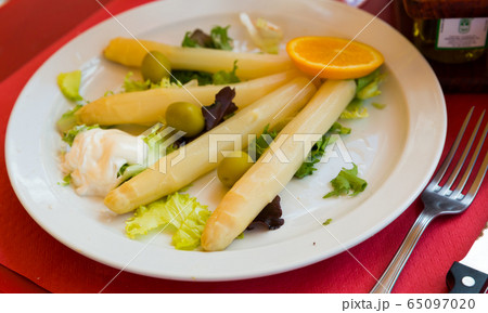 Baked white asparagus with greens Baked white asparagus with greens 65097020