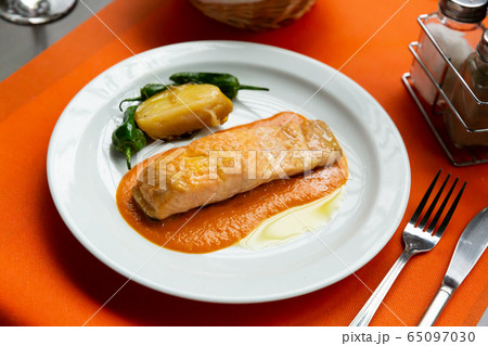 Roasted salmon with bell peppers and potato Roasted salmon with bell peppers and potato 65097030