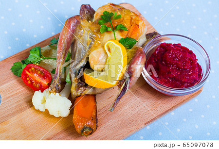 Roasted partridge with cranberry sauce and grilled vegetables Roasted partridge with cranberry sauce and grilled vegetables 65097078
