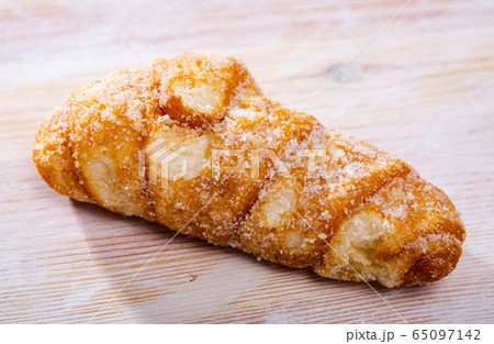 Catalan sweet bun with icing and sugar. Spanish dish 65097142