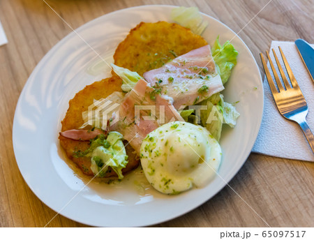 Potato pancakes with bacon and egg 65097517