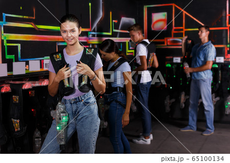 Glad friends looking laser guns and clothes Glad friends looking laser guns and clothes 65100134