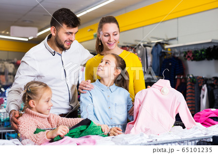 Family buying children clothes Family buying children clothes 65101235
