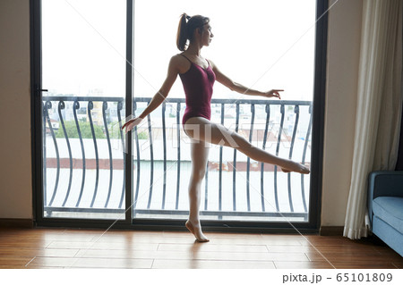 Ballet dancer enjoying dancing 65101809