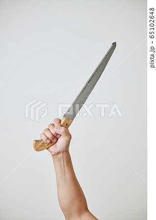 Repairman showing hacksaw 65102648