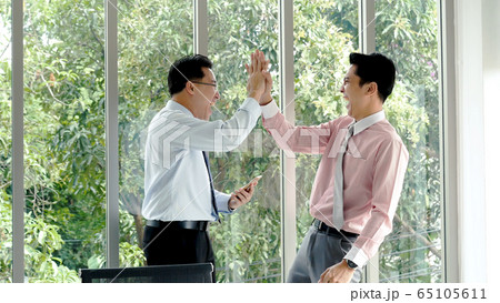 Success Businessman happy got good news from Success Businessman happy got good news from 65105611