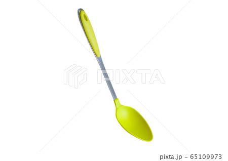 Green spoon on a white background 65109973
