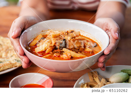 Thai local homemade food red curry with chicken in ceramic bowl Thai local homemade food red curry with chicken in ceramic bowl 65110262