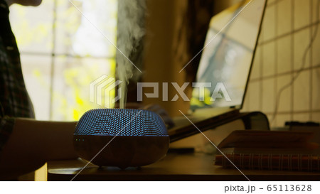 Vapor coming from blue led esential oil diffuser 65113628