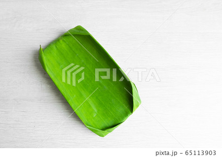 Green leaf of a banana. Eco dishes for food. Green leaf of a banana. Eco dishes for food. 65113903
