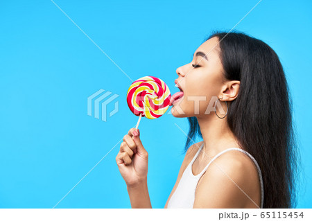 Young girl lick Girl licking a lollypop - Stock Image - F012/0742 - Science ...