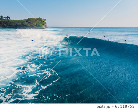Surfing waves in ocean and shore. Aerial view of surf spot. Surfing waves in ocean and shore. Aerial view of surf spot. 65119755