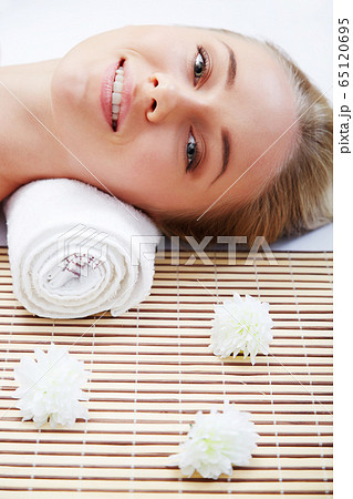 Young beautiful woman in spa environment Young beautiful woman in spa environment 65120695