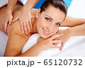 Young beautiful woman in spa environment 65120732